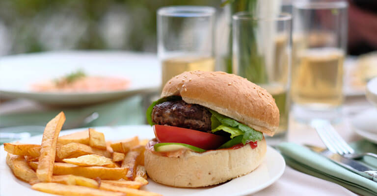 Hamburger and fries, served at outdoor dining in Northville, MI